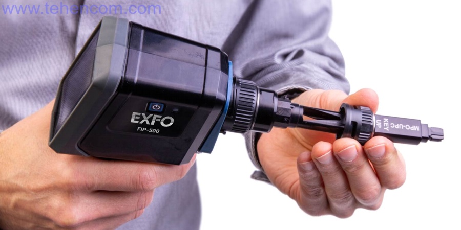 To replace the removable attachment of the EXFO FIP-500 video microscope, simply turn it 90 degrees